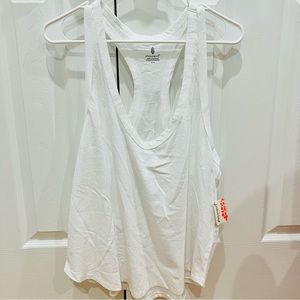 NWT FREE PEOPLE WHITE TANK IN SIZE MEDIUM